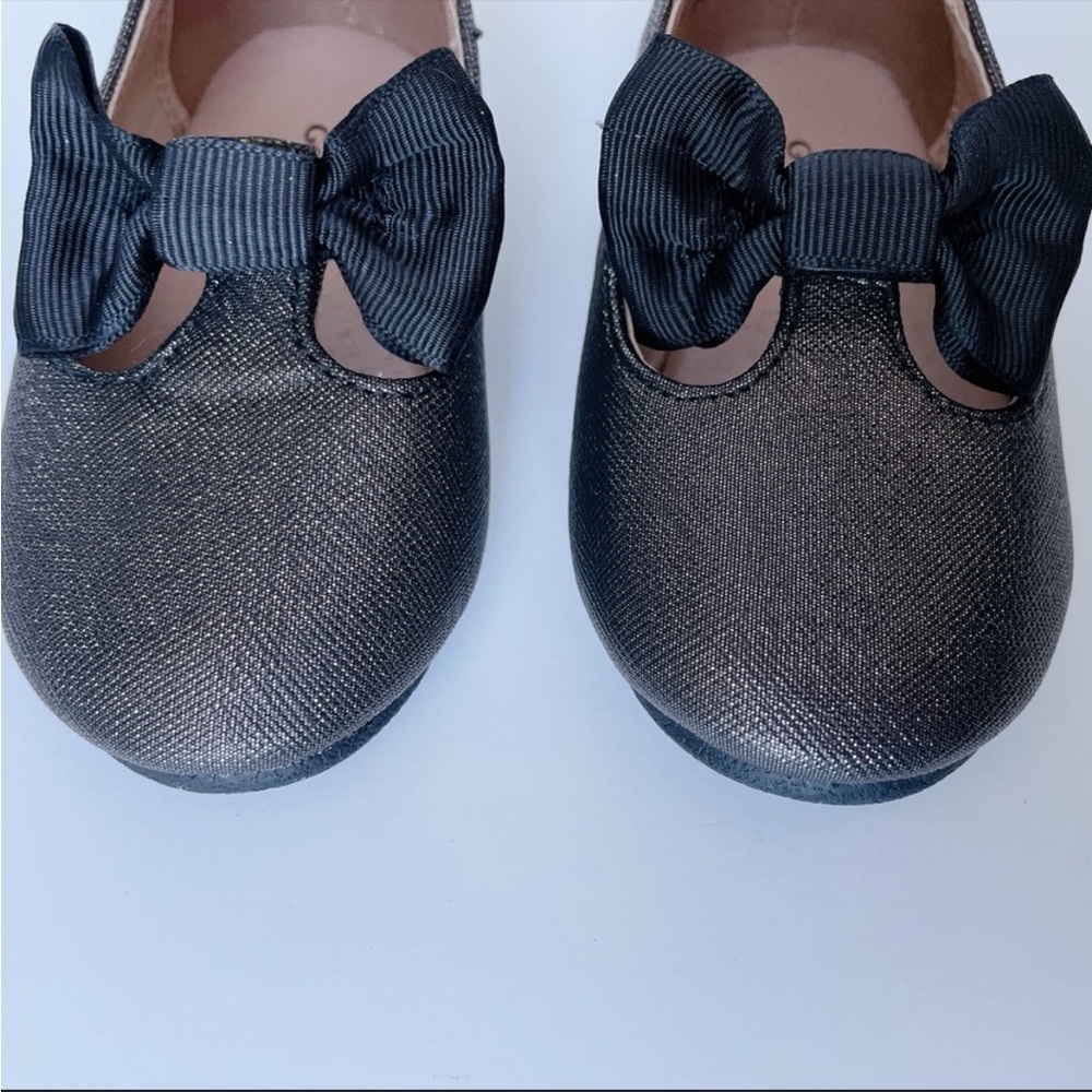 Sparkly flats (black/gold shimmer) with black bows - adorable for a little girl
